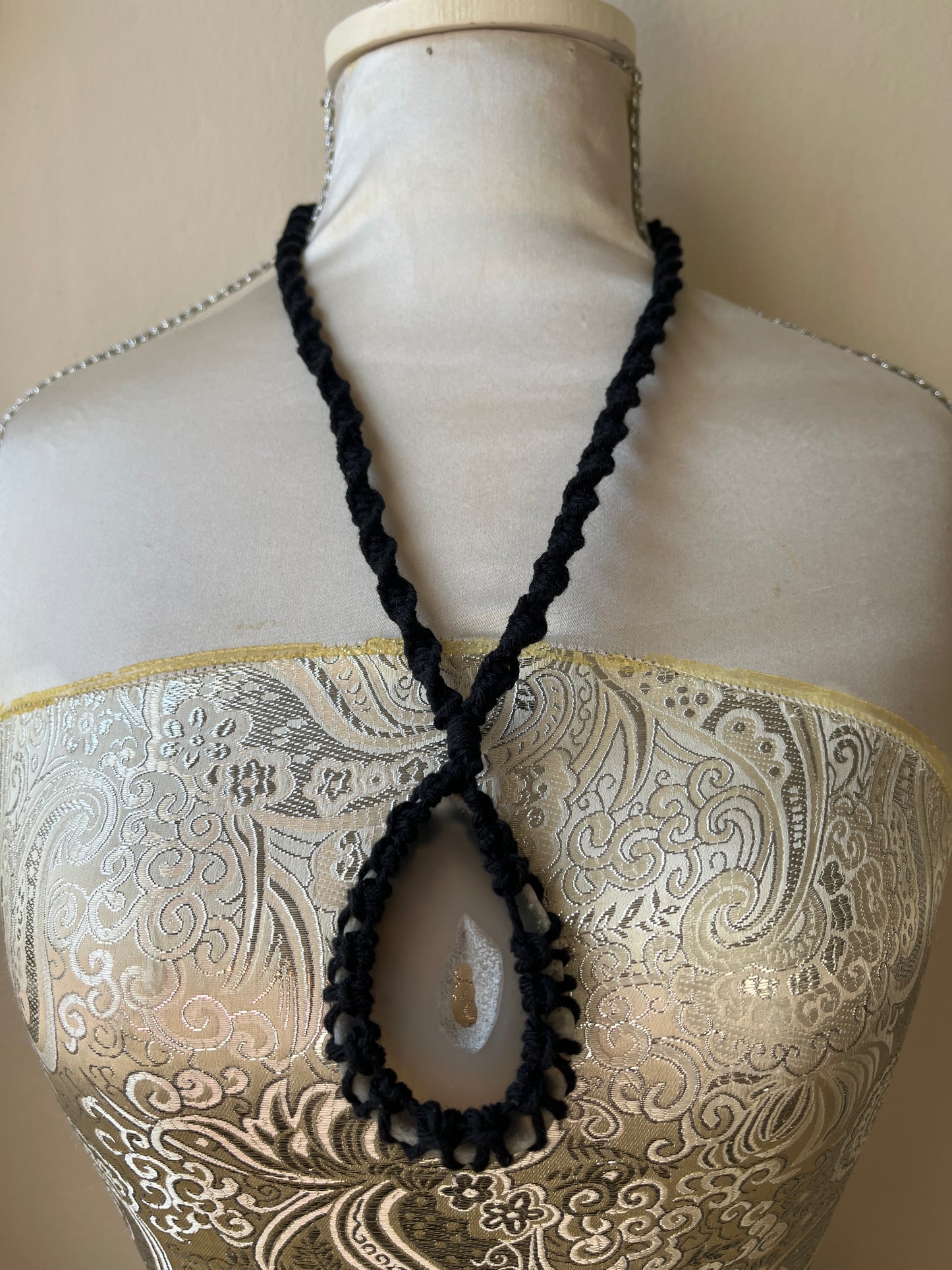Black necklace with natural agate slice on a mannequin