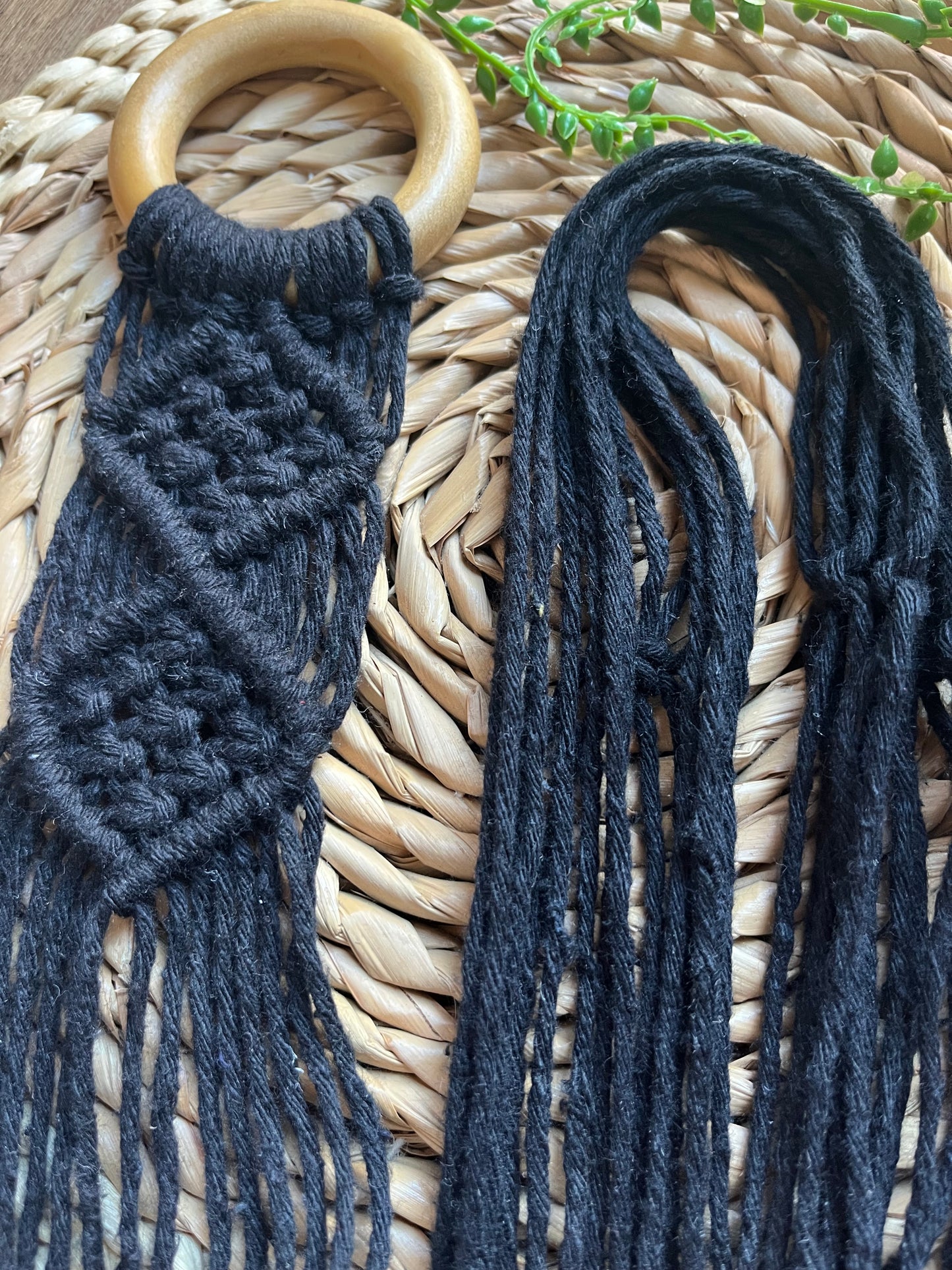 Mini sitar instrument wall hanger. Handmade using black recycled cotton on a repurposed wooden hanging ring.