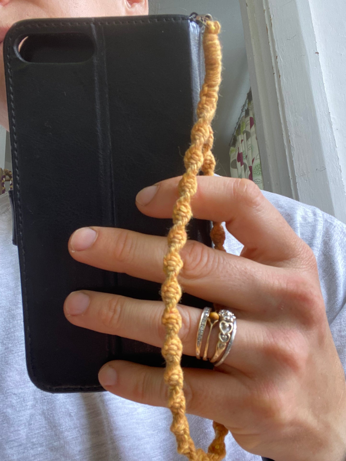 Macra-Made With Love twisted phone charm mustard on hand