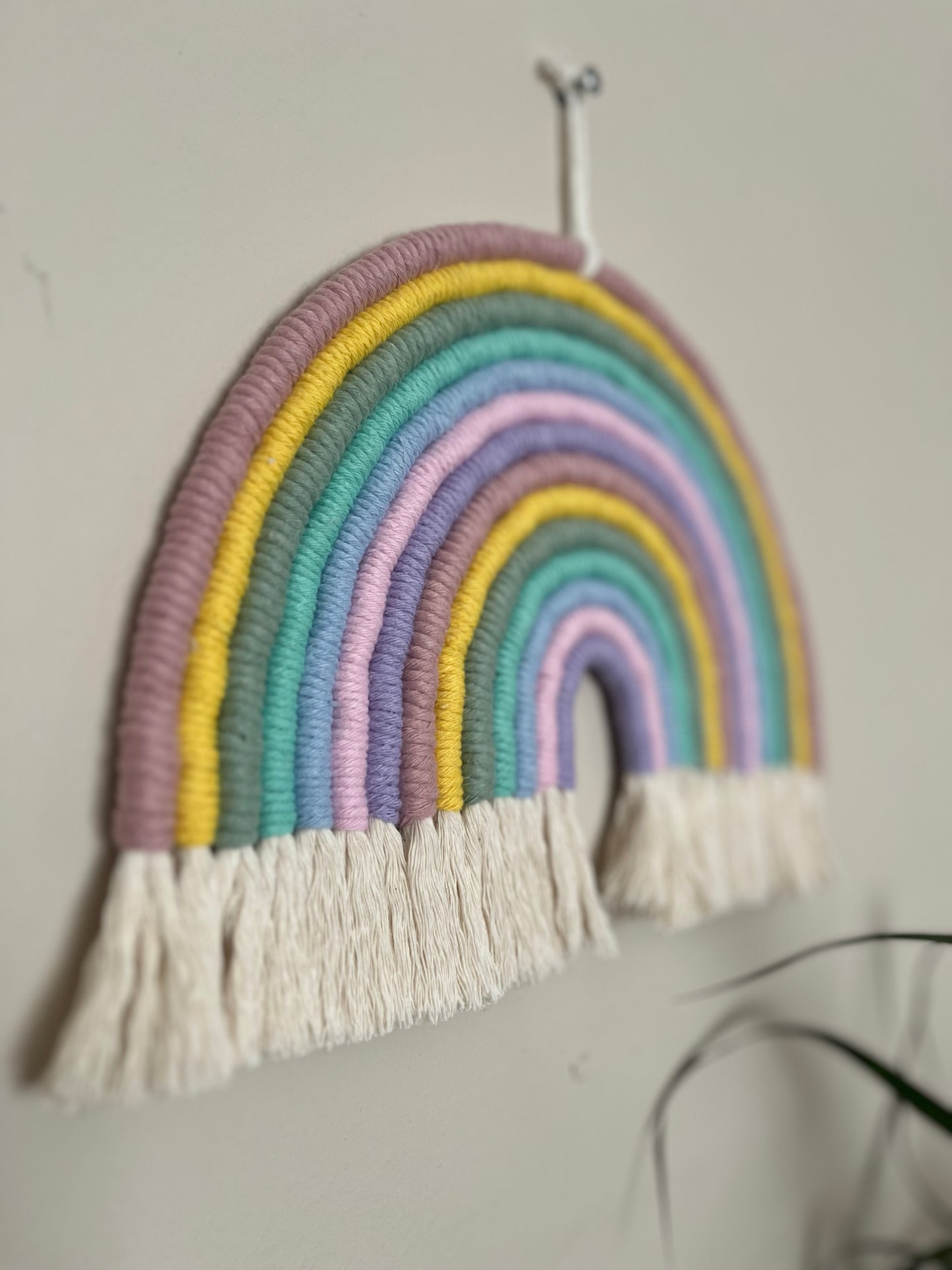 Handmade macrame wall hanging rainbow, made with pastel recycled cotton