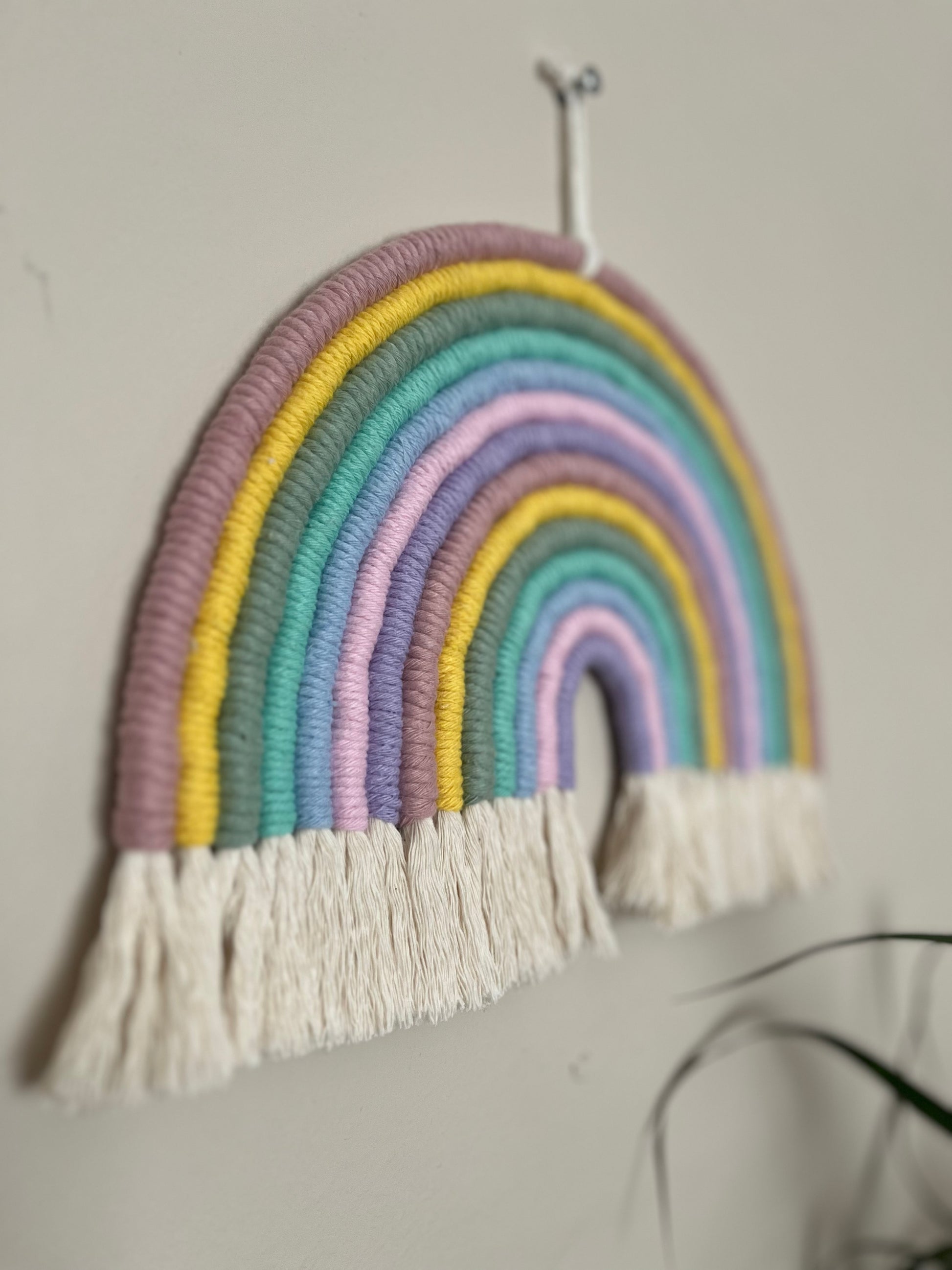 Handmade macrame wall hanging rainbow, made with pastel recycled cotton