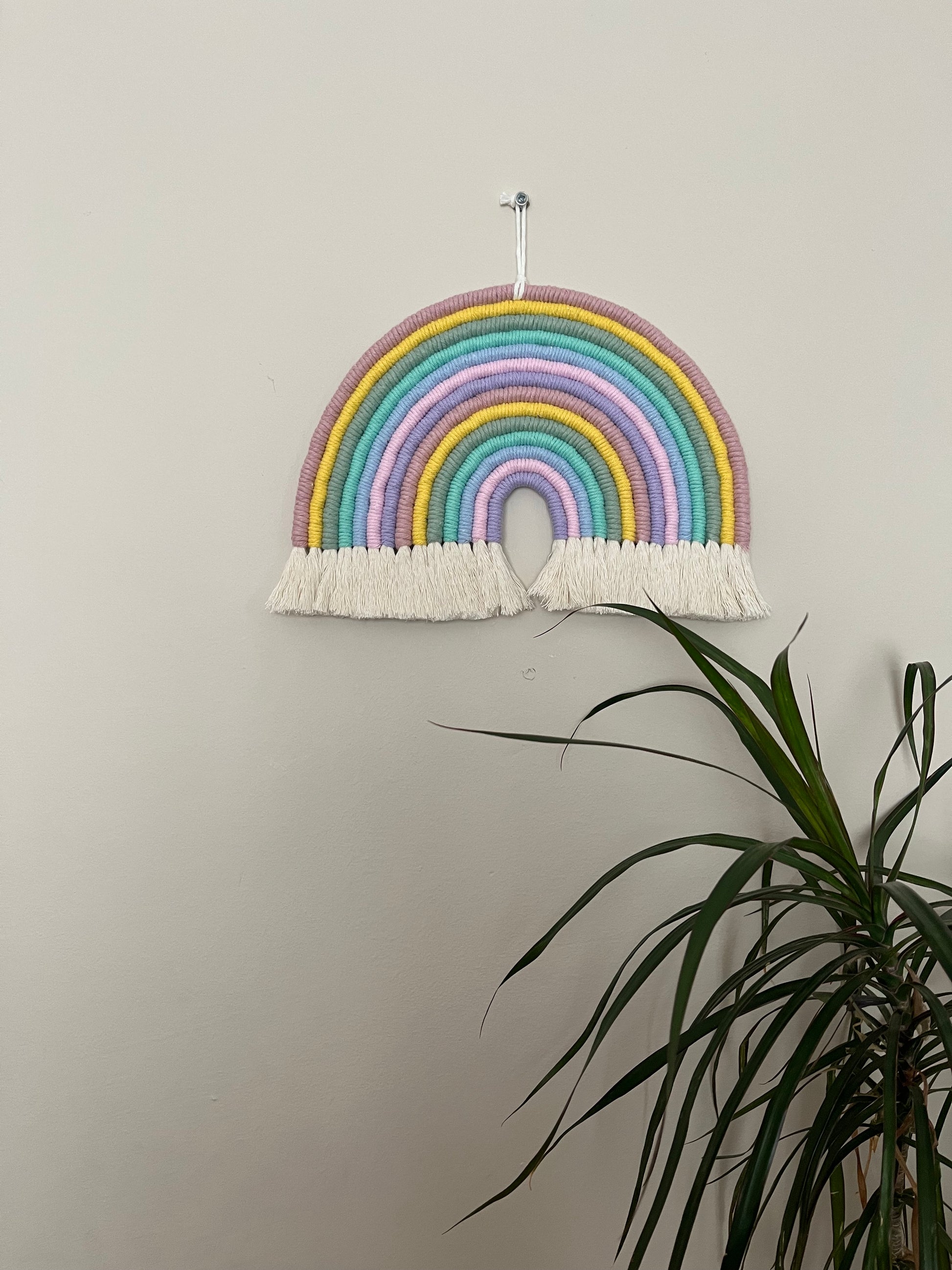 Macrame wall hanging rainbow, handmade using recycled cotton in pastel rainbow colours