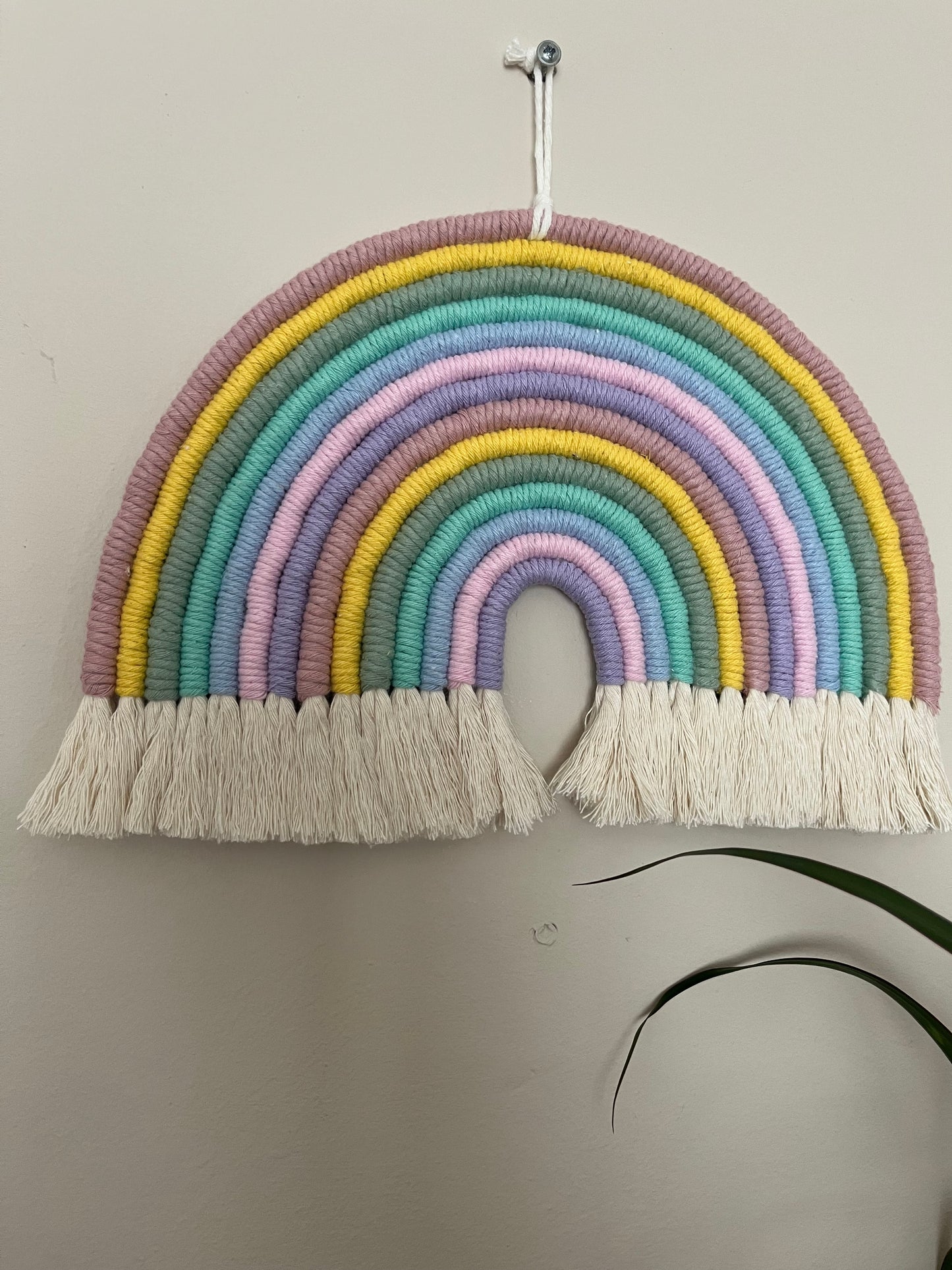 Handmade macrame rainbow, made with pastel colours of recycled cotton