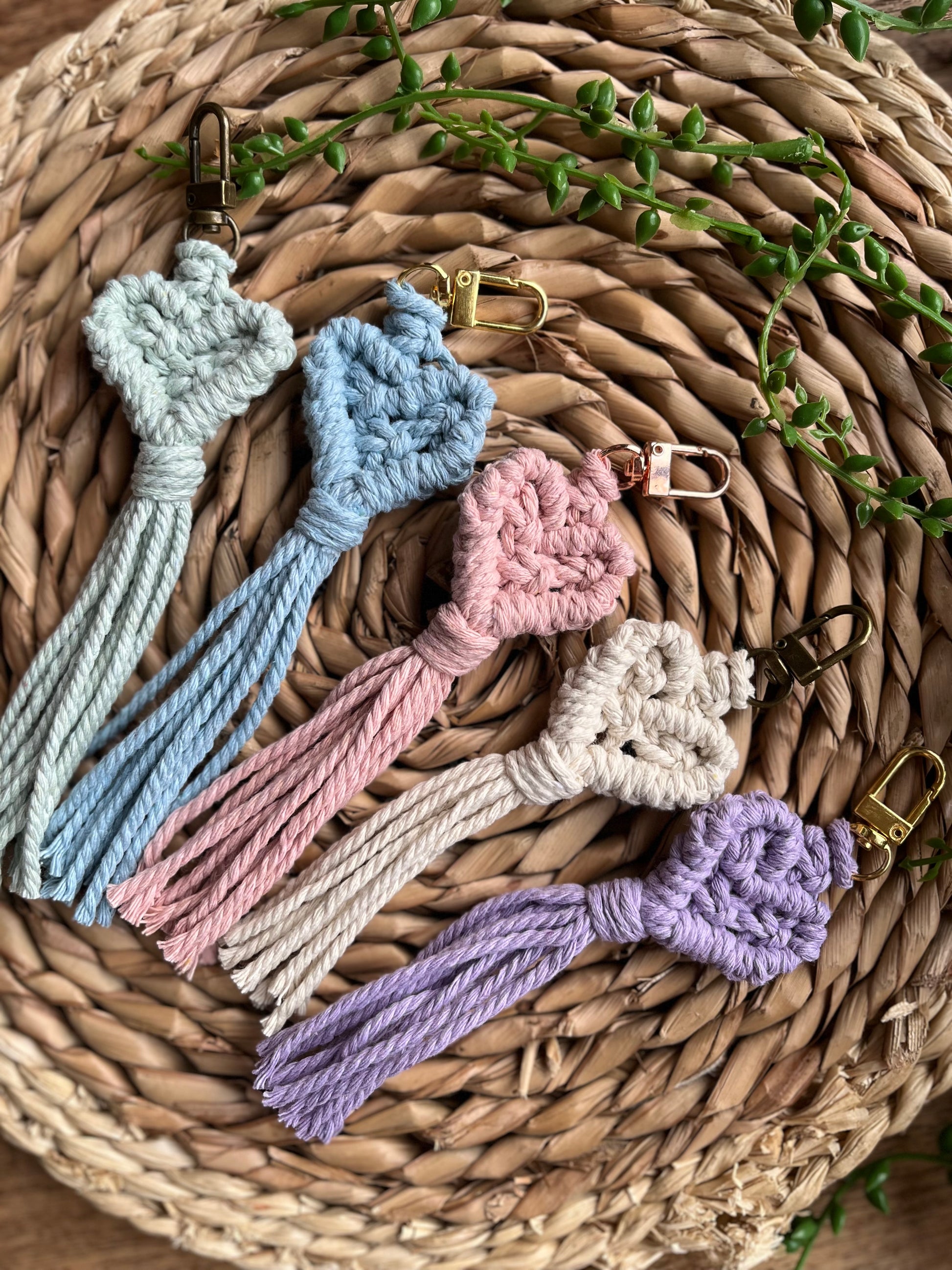 Handmade macrame heart shaped keychains made with recycled cottons in pastel shades.