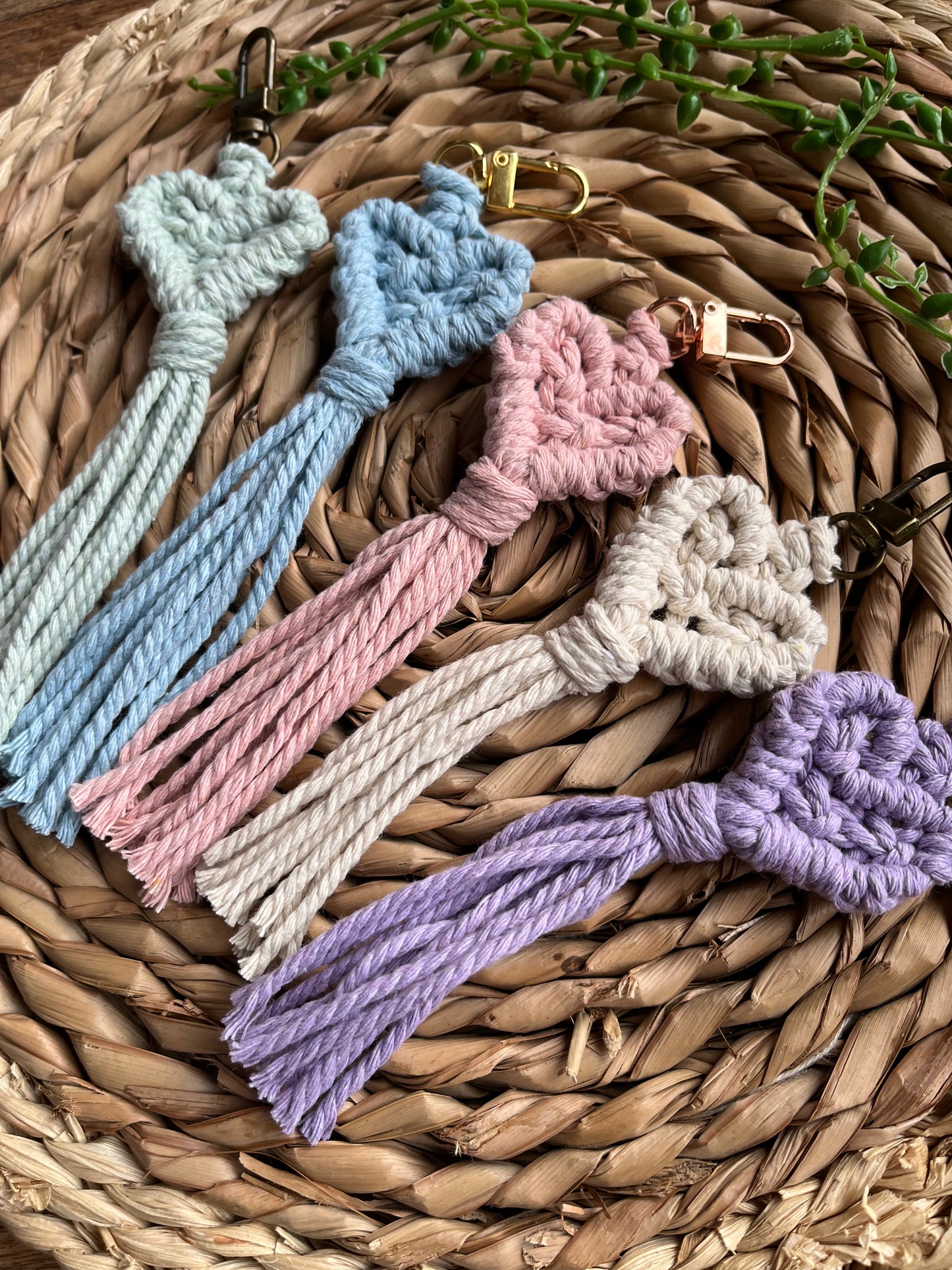 Handmade macrame heart shaped keychains made with recycled cotton in pastel shades.