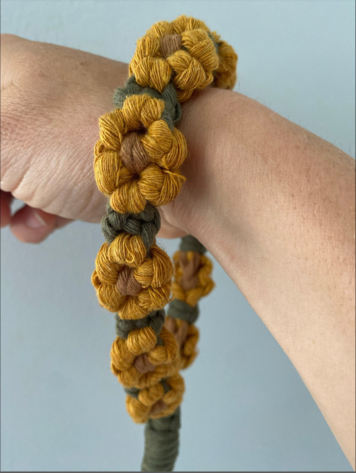 Handmade macrame sunflower wristlet keychain made with recycled yarn