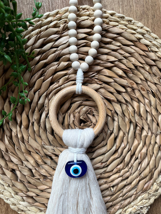 Natural coloured door hanger with evil eye bead, and wooden bead hanging loop. Made with recycled cotton yarn.