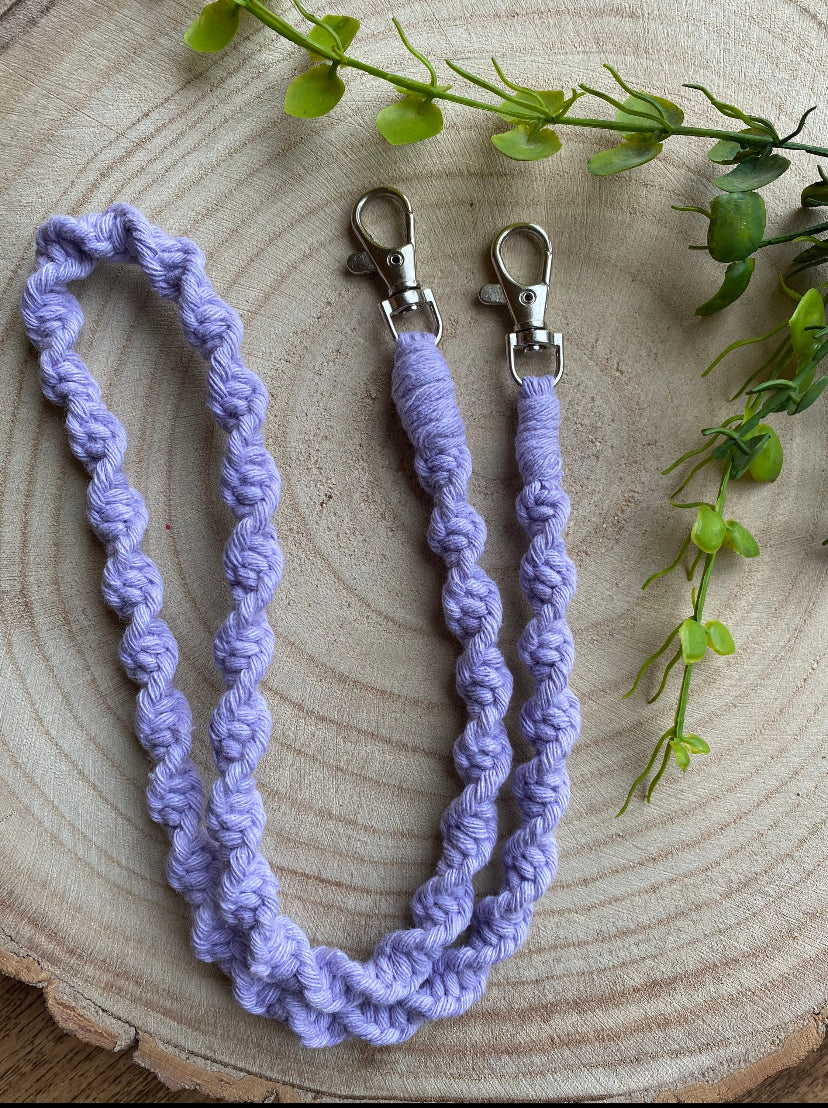 Handmade macramé face mask lanyard in lilac cotton cord with small metal clips on each end.