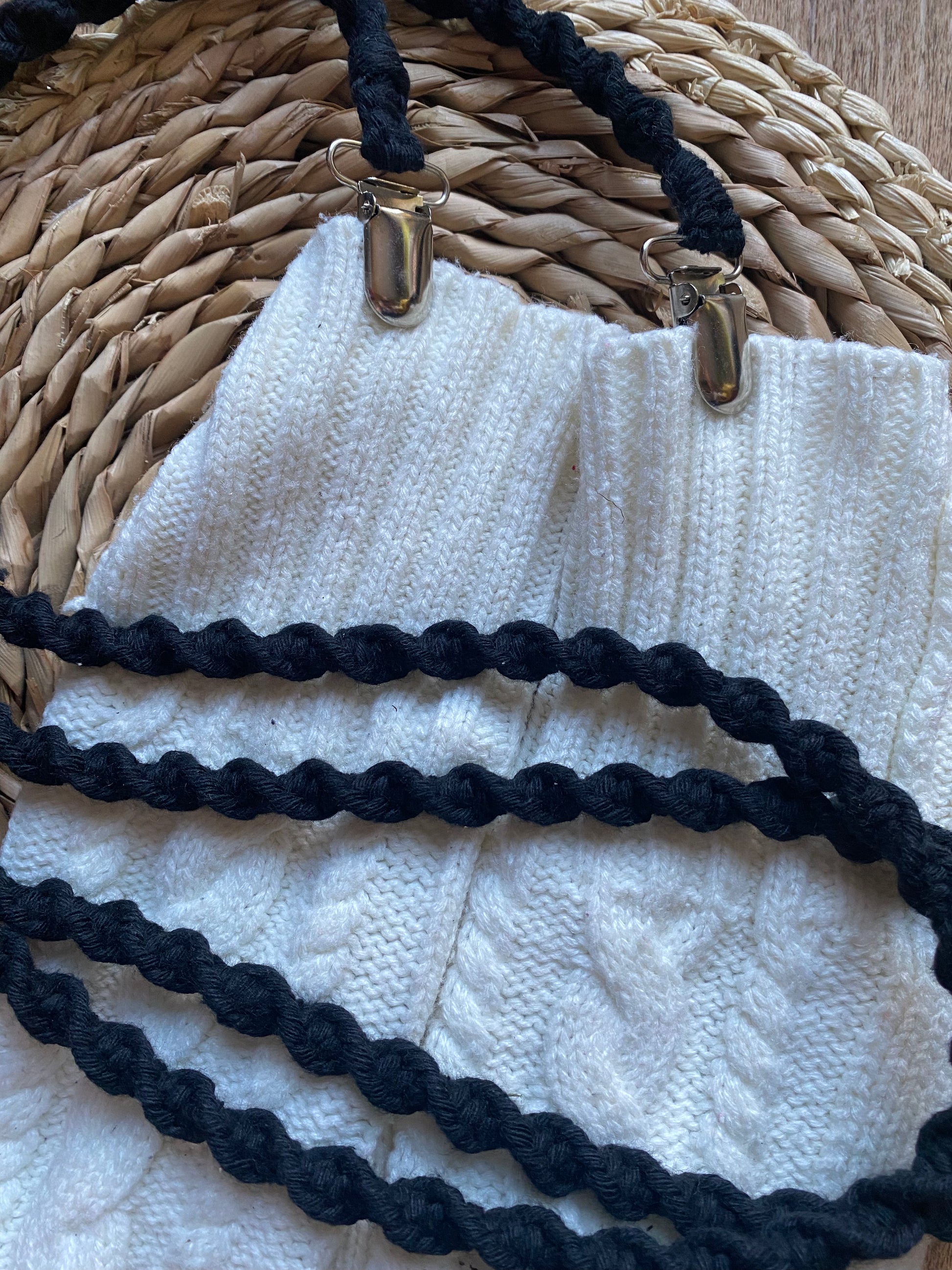 Black eco-friendly long mitten clips laid flat on white mittens - 190cm handmade winter accessory by Macra-Made With Love