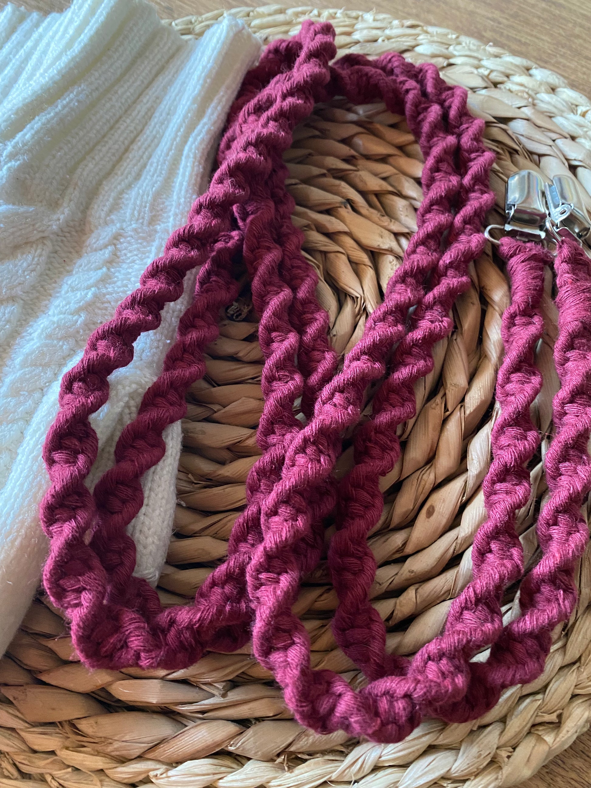 Angled close-up of deep red eco-friendly long mitten clips - showing texture and detail of handmade sustainable winter accessory