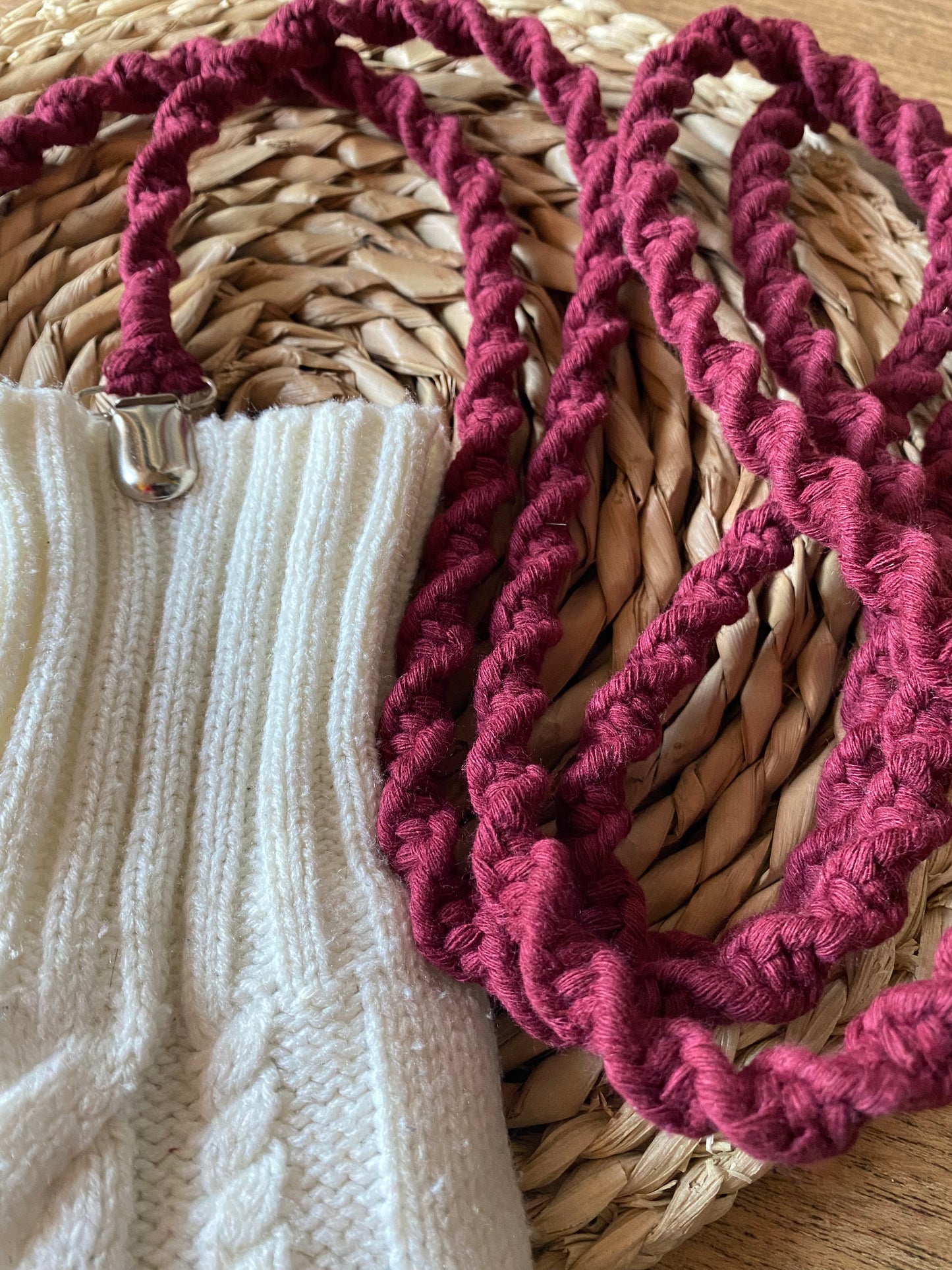 Close-up of handcrafted knots on deep red recycled cotton long mitten clips - showing quality craftsmanship and sustainable materials