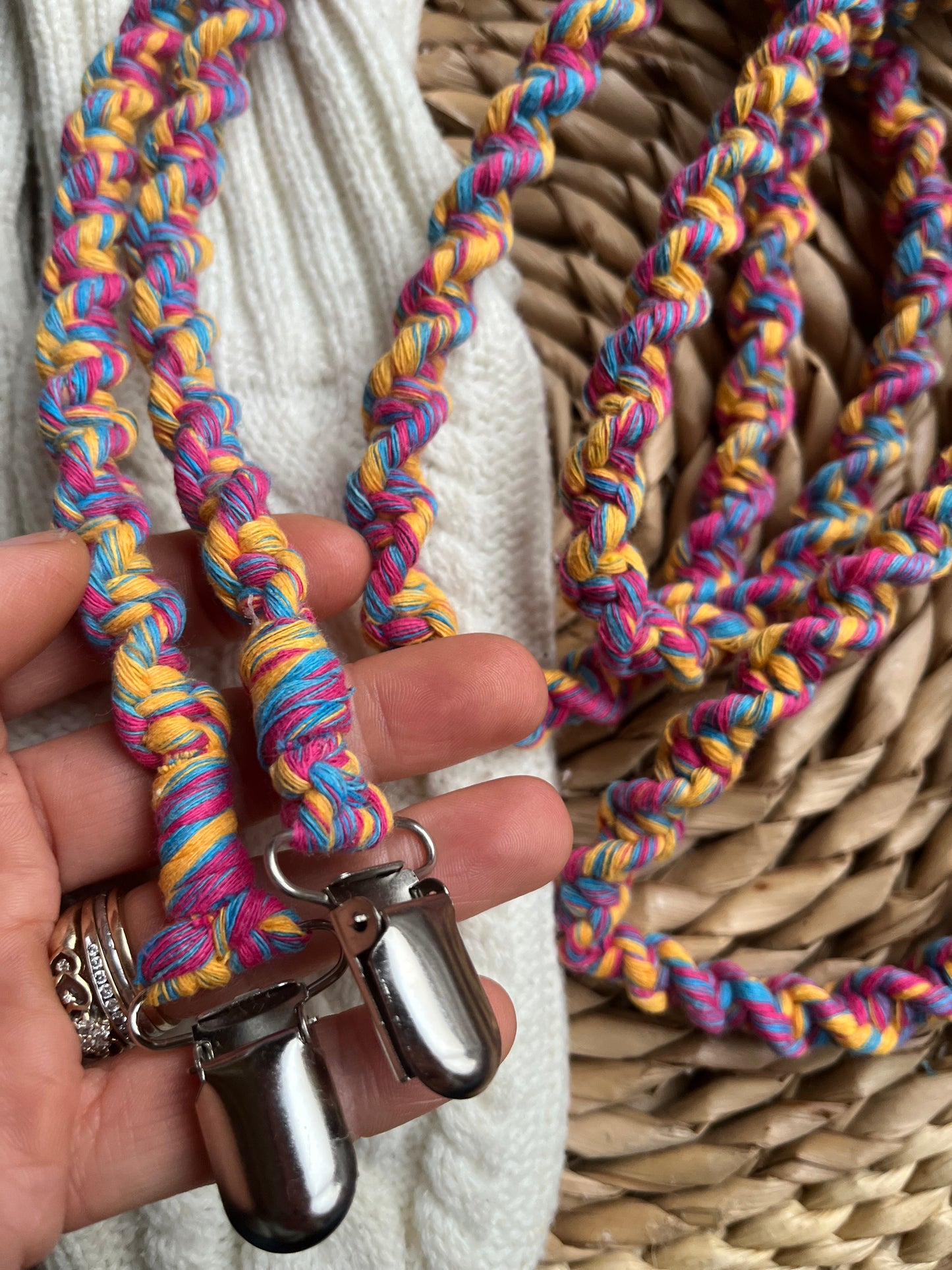 Hand holding handmade eco-friendly long mitten clips (190cm) in multicoloured recycled cotton - Macra-Made With Love sustainable winter accessory