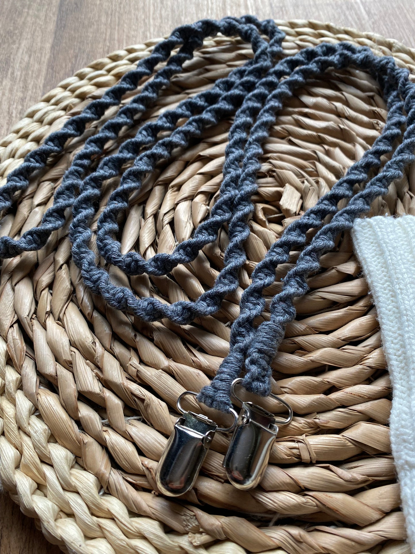 Angled close-up of grey eco-friendly long mitten clips - showing texture and detail of handmade sustainable winter accessory