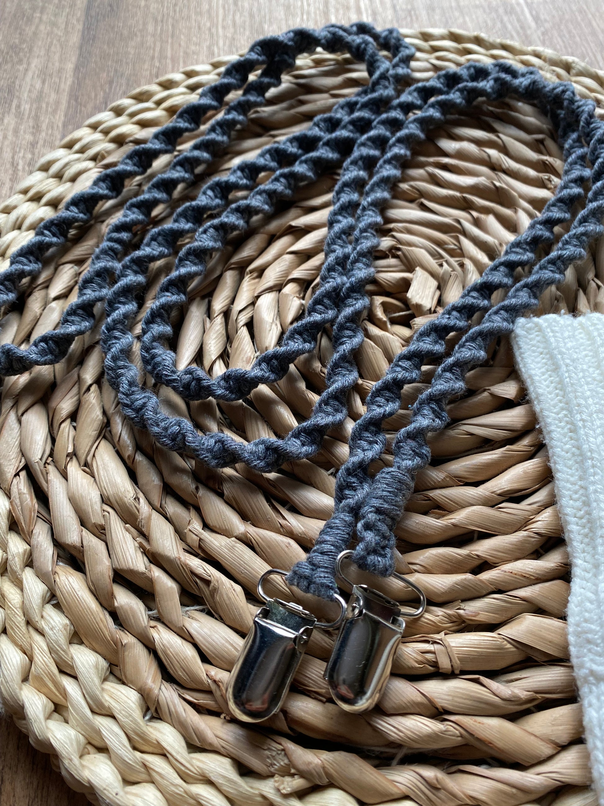 Angled close-up of grey eco-friendly long mitten clips - showing texture and detail of handmade sustainable winter accessory