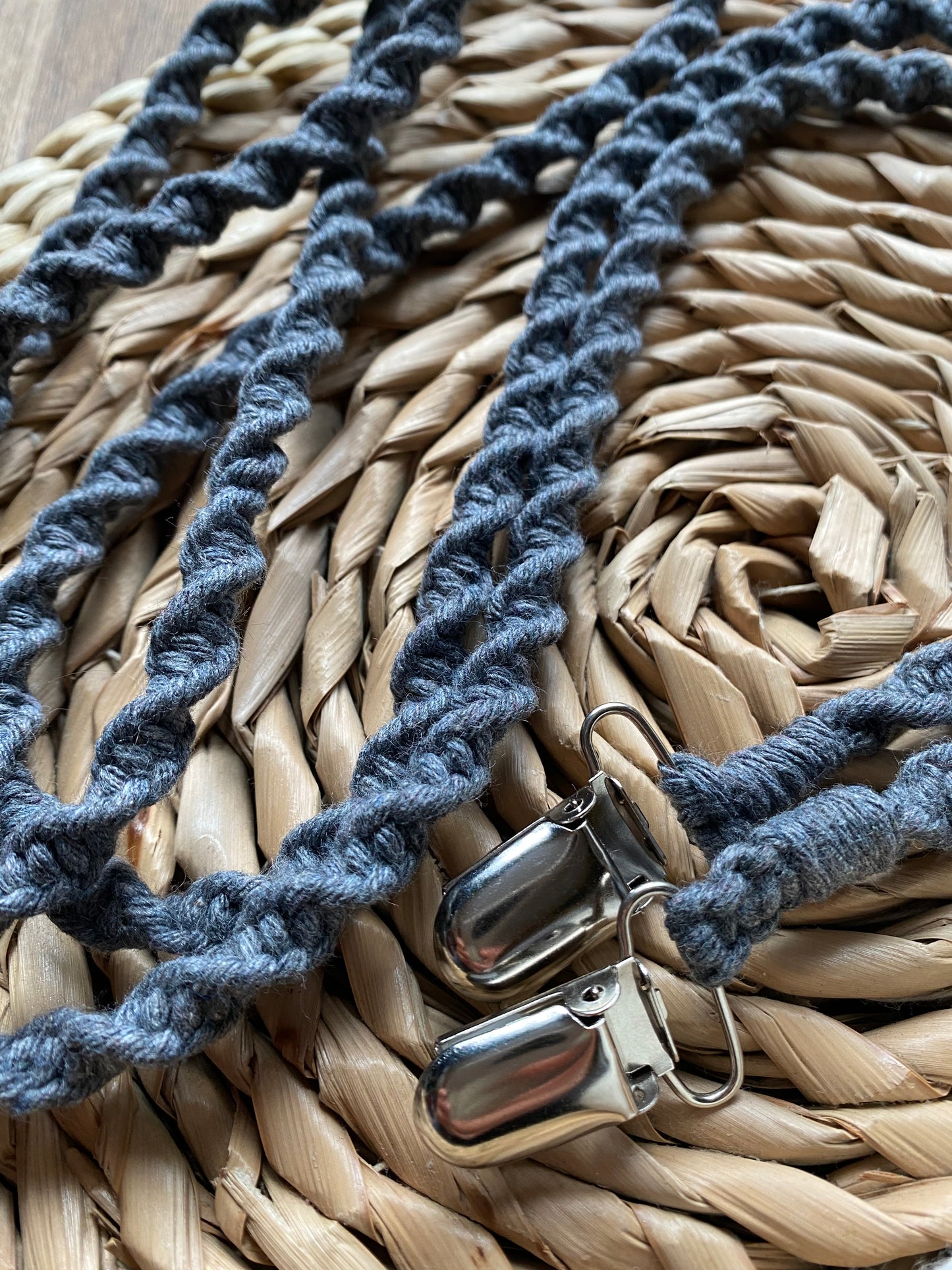 Close-up of handcrafted knots on grey recycled cotton long mitten clips - showing quality craftsmanship and sustainable materials
