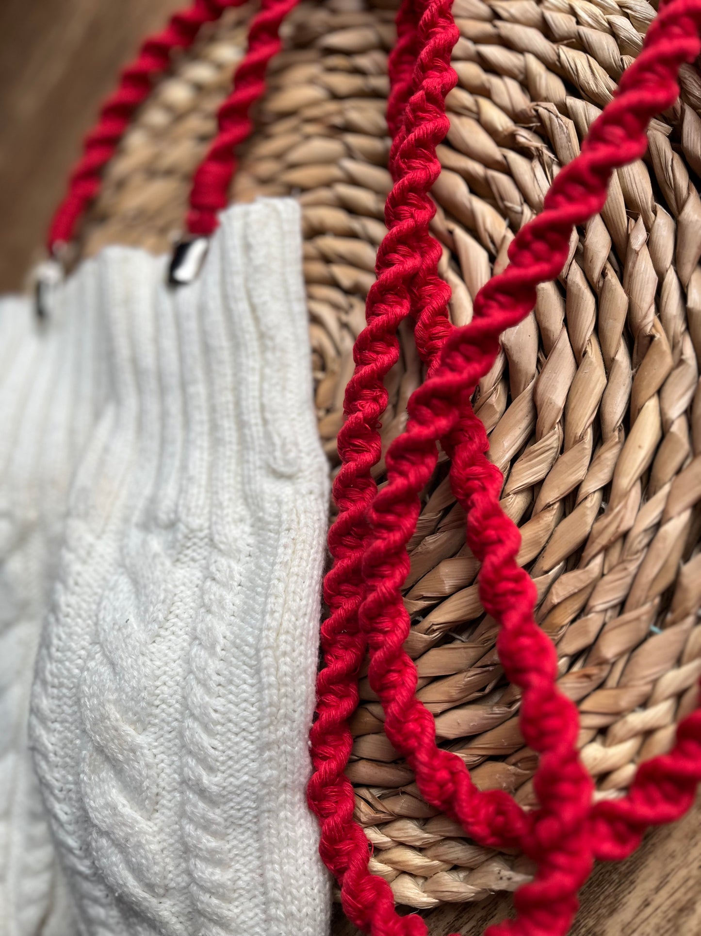 Angled close-up of bright red eco-friendly long mitten clips - showing texture and detail of handmade sustainable winter accessory
