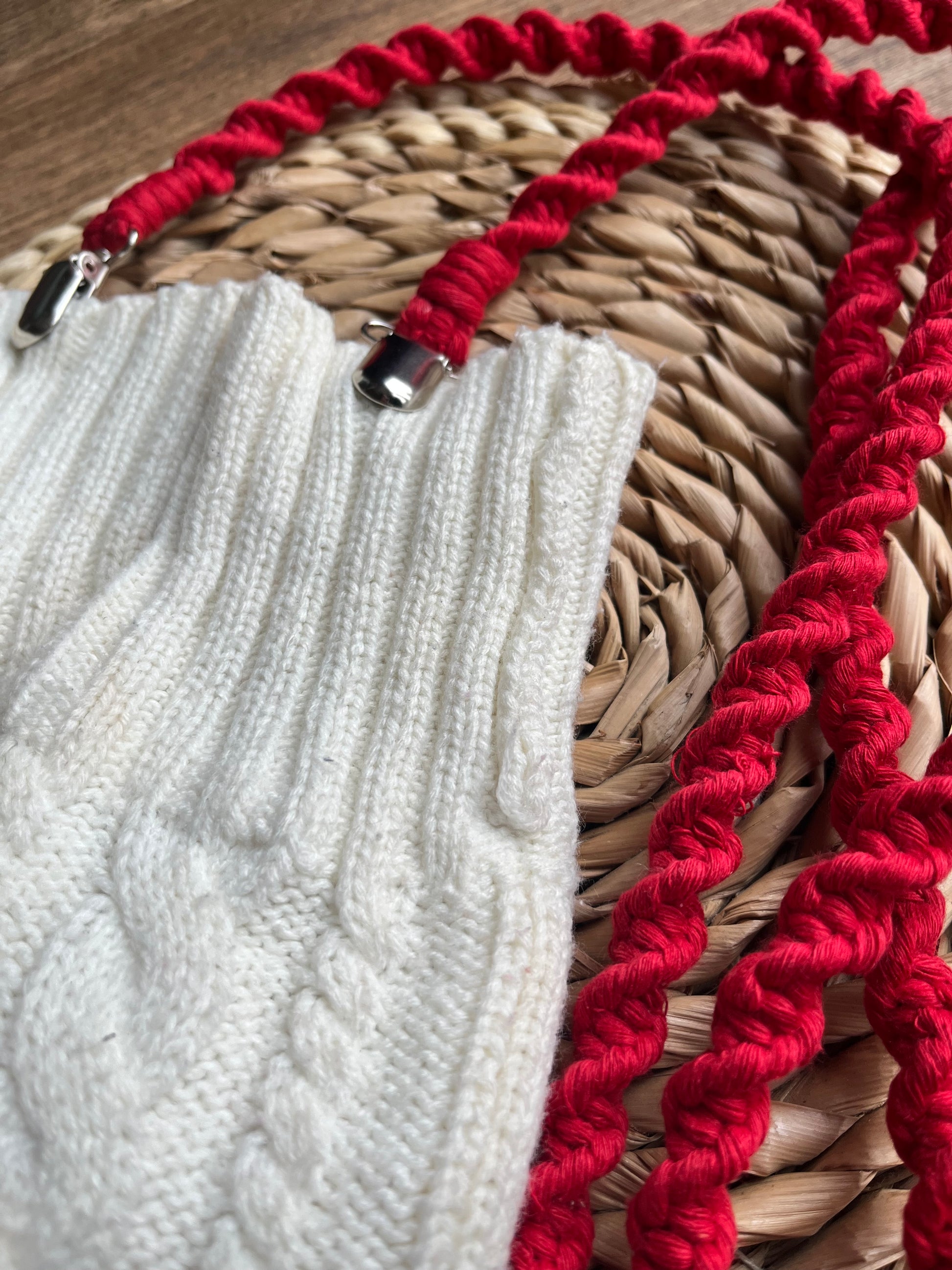 Angled close-up of bright red eco-friendly long mitten clips - showing texture and detail of handmade sustainable winter accessory