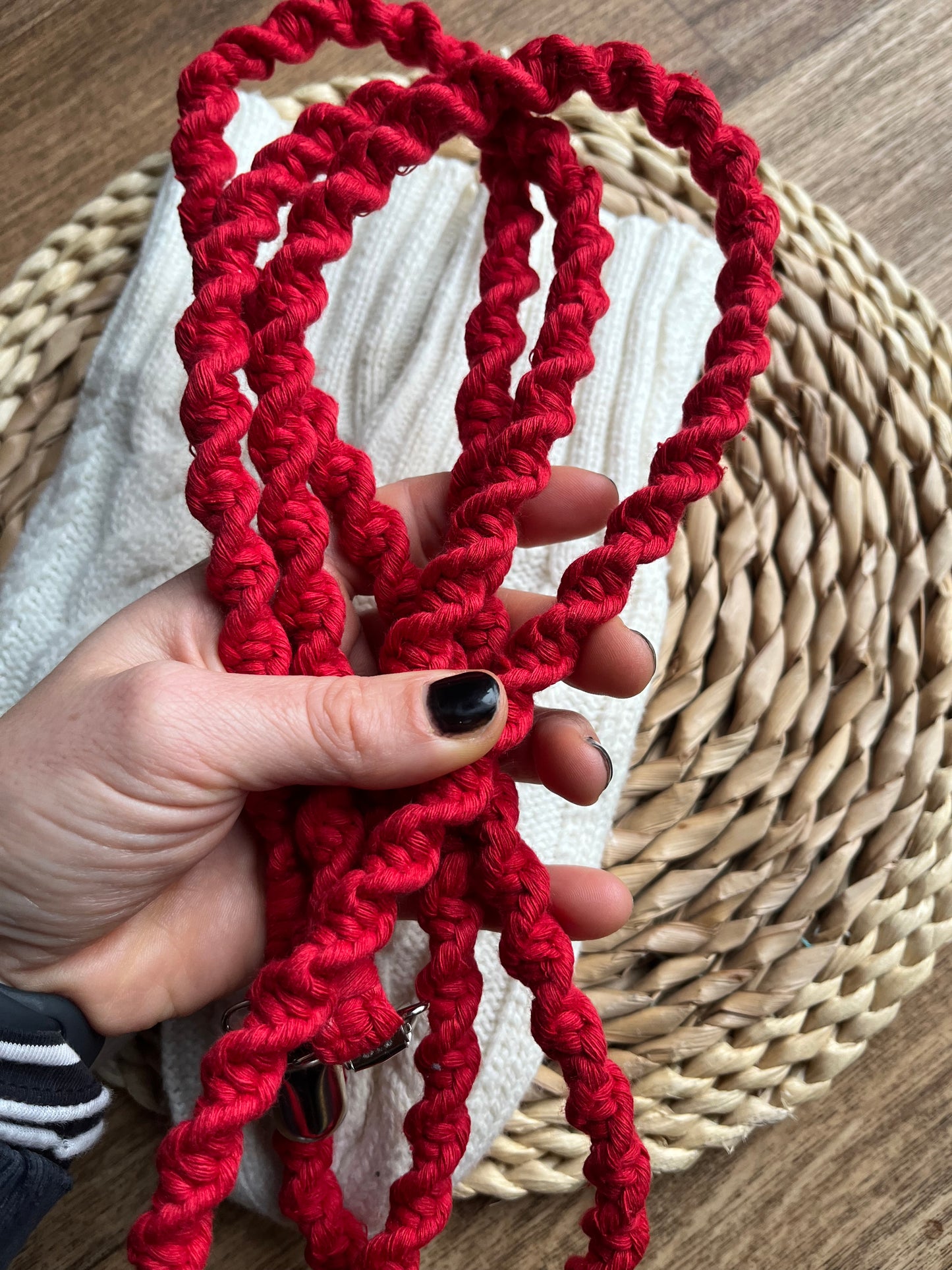 Hand holding handmade eco-friendly long mitten clips (190cm) in bright red recycled cotton - Macra-Made With Love sustainable winter accessory