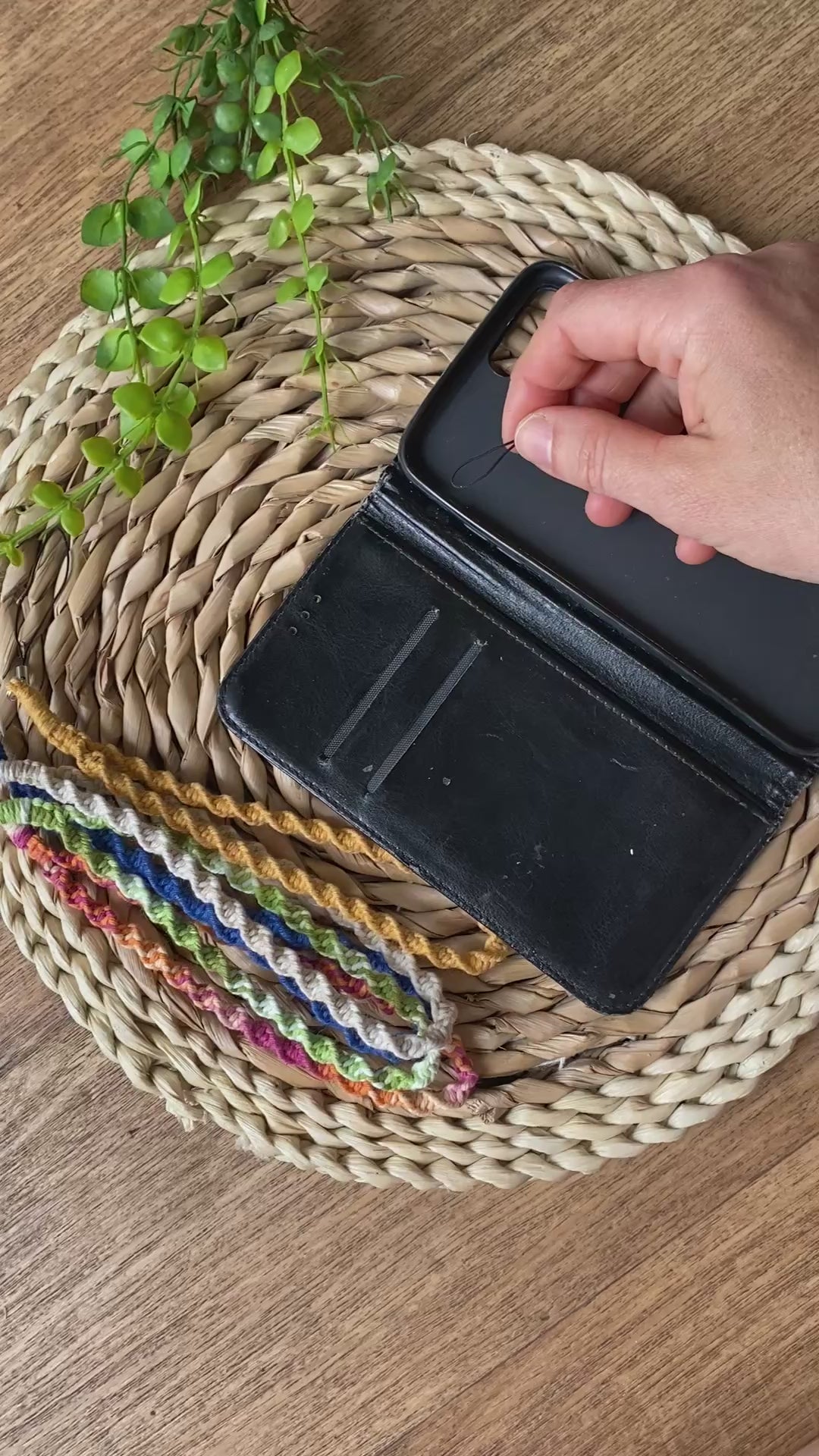 A video demonstrating how to attach a macrame phone charm on to a phone case.