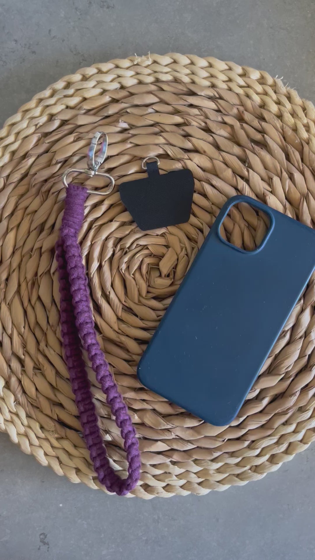 A video demonstrating how to attach a macrame phone charm wristlet on to your phone case using a universal tether.
