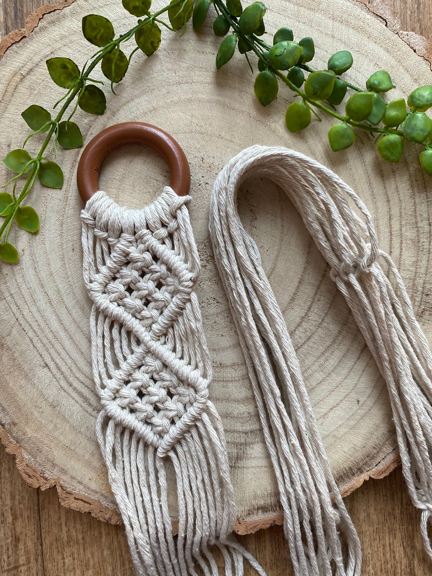 Mini sitar instrument wall hanger. Handmade using natural recycled cotton on a repurposed wooden hanging ring.