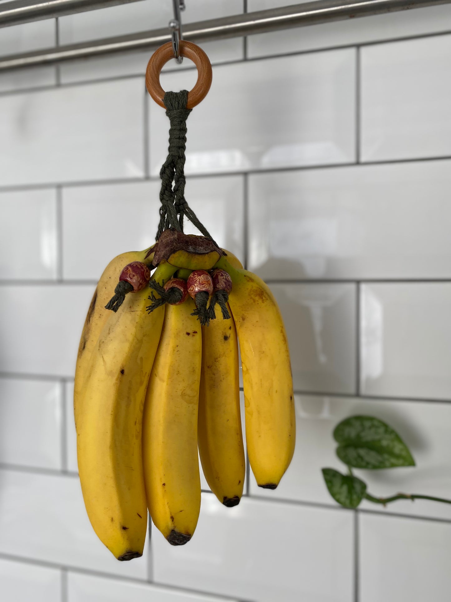 Banana hanger kitchen decor green patterned focus