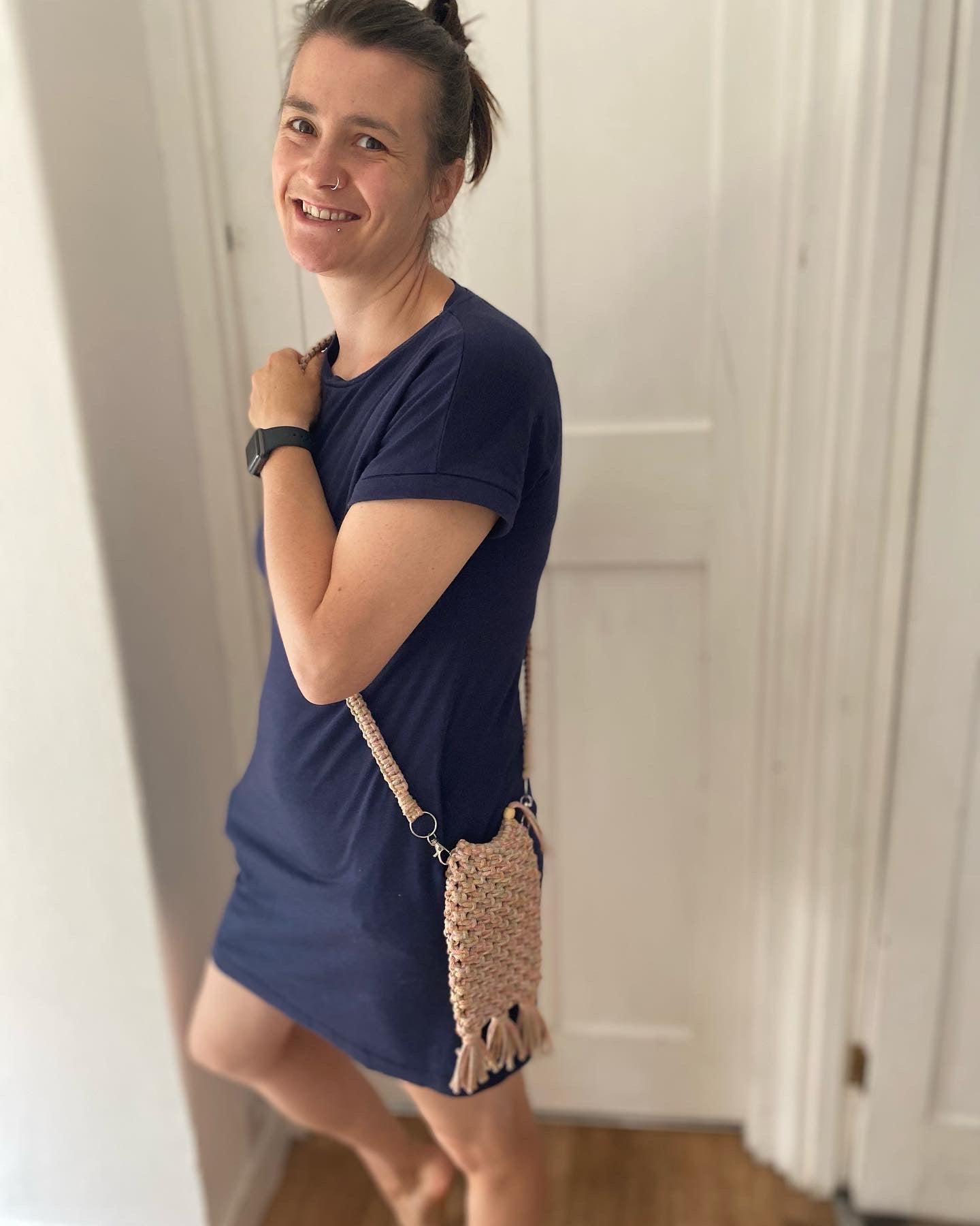 Macra-Made With Love phone bag rainbow being worn inside smile