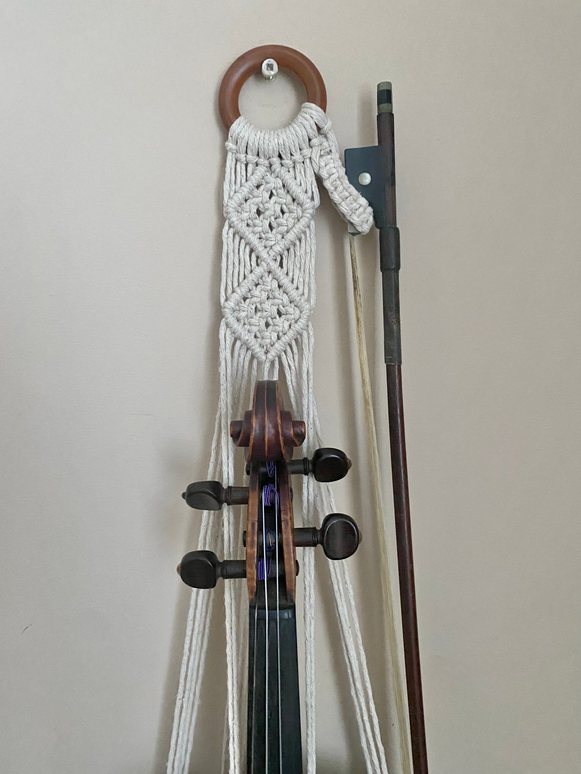 Macra-Made With Love violin wall mount and bow holder made with natural recycled cotton and a wooden ring.