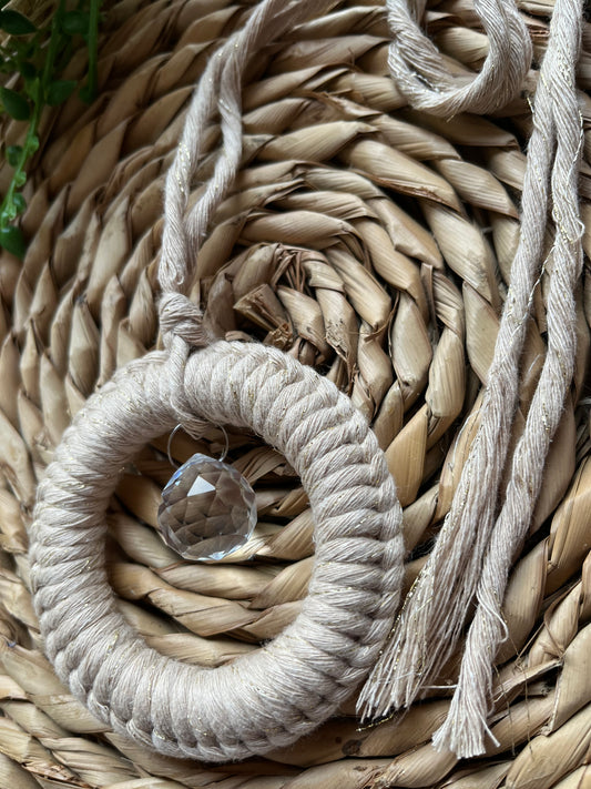 Small round macrame wrapped sun catcher hanging decoration with a small crystal prism, made with recycled cotton yarn. 