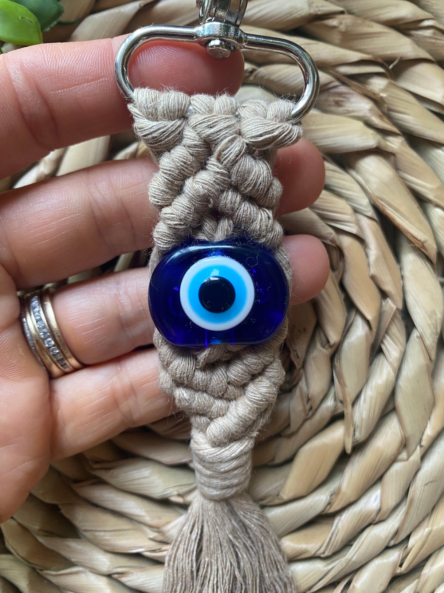 Macra-Made With Love evil eye keychain in hand 