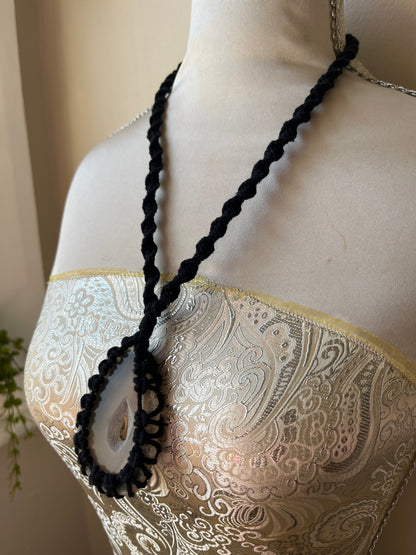 Black necklace with natural agate slice on mannequin 