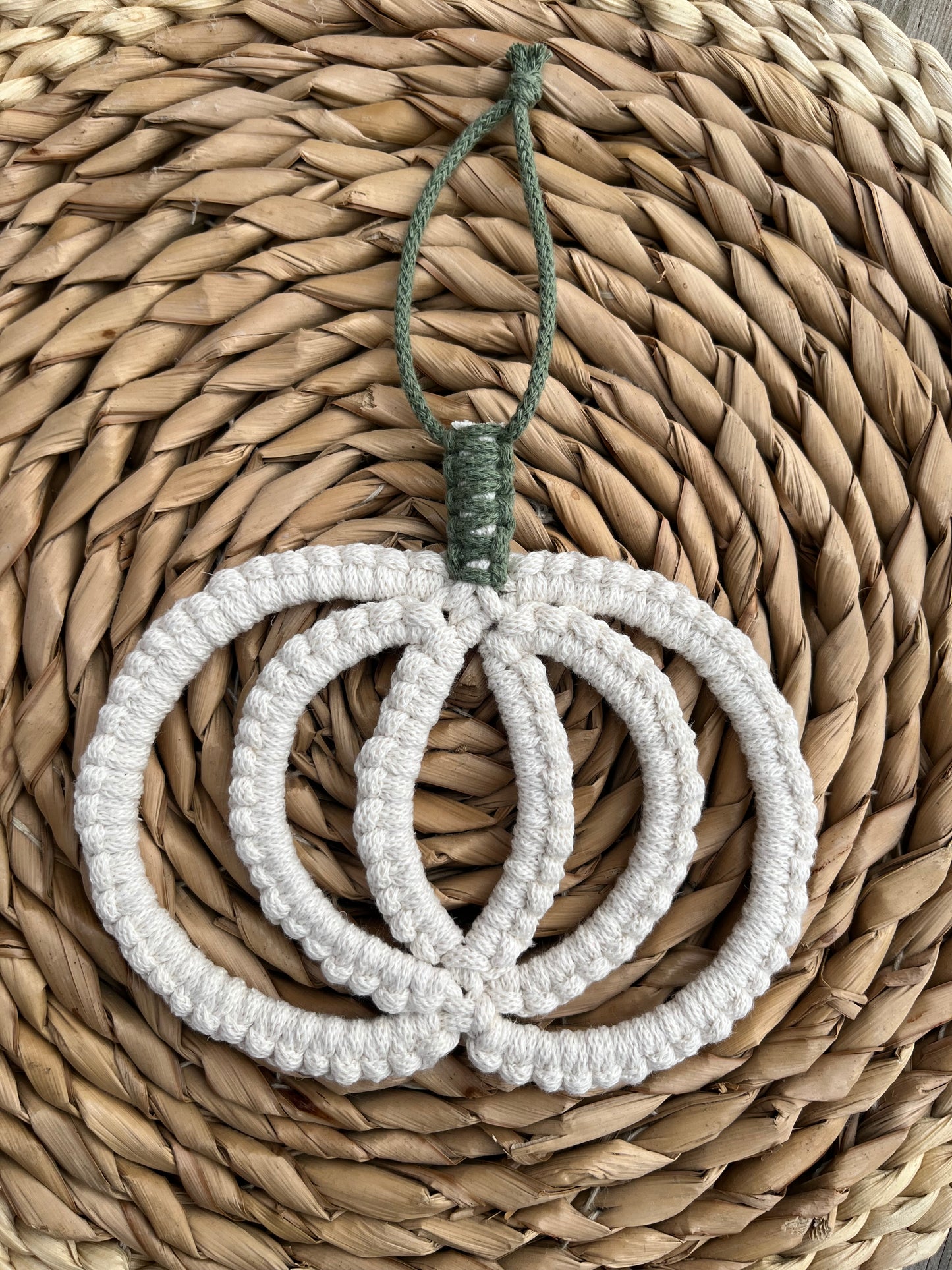 Pumpkin shaped macrame wall hanging decoration made with natural coloured recycled cotton yarn 