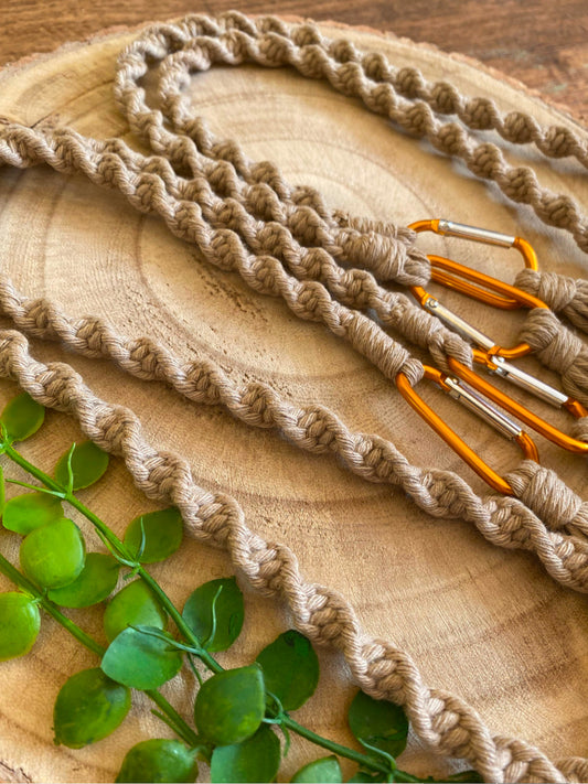 A pair of knotted replacement bag straps, with carabiner clip attachments. Made with recycled cotton yarn.