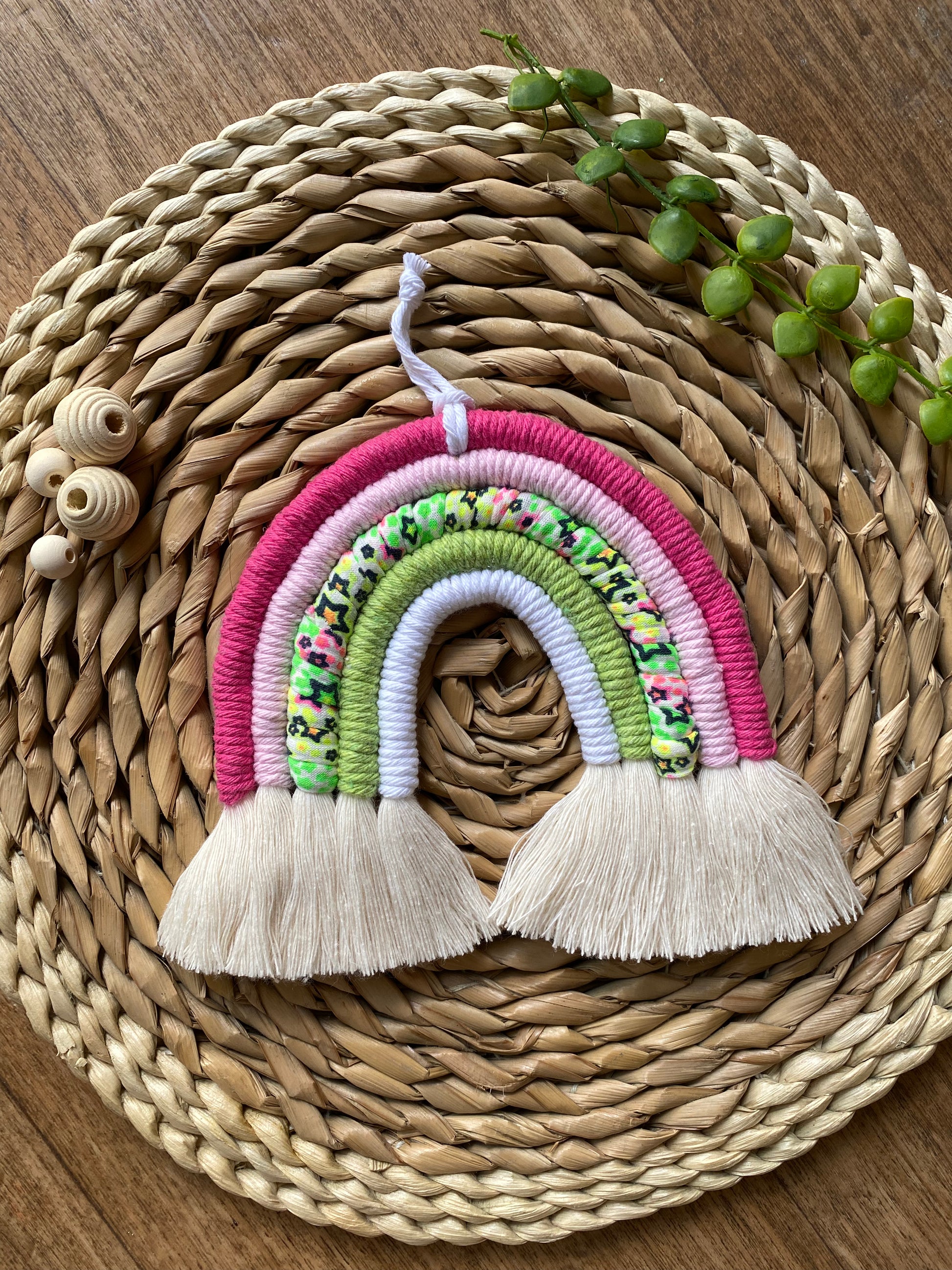 Bright neon macrame rainbow flat lay