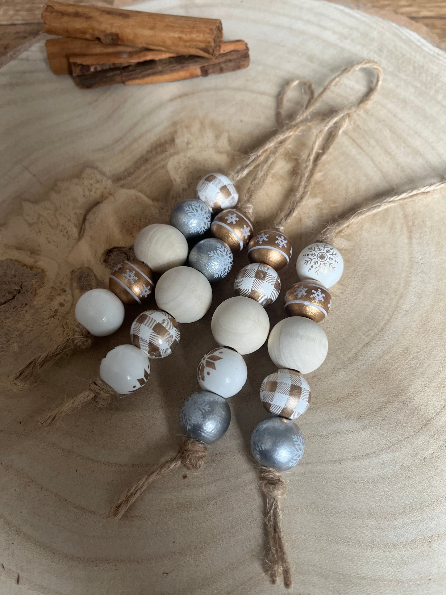 Decorative string of multicolored beads on a wooden surface