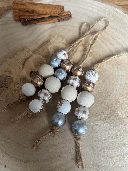Decorative string of multicolored beads on a wooden surface