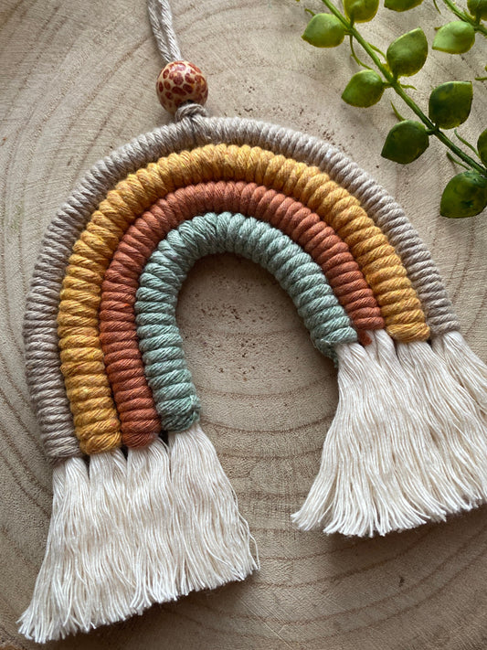 Neutral macrame rainbow flat lay angle 