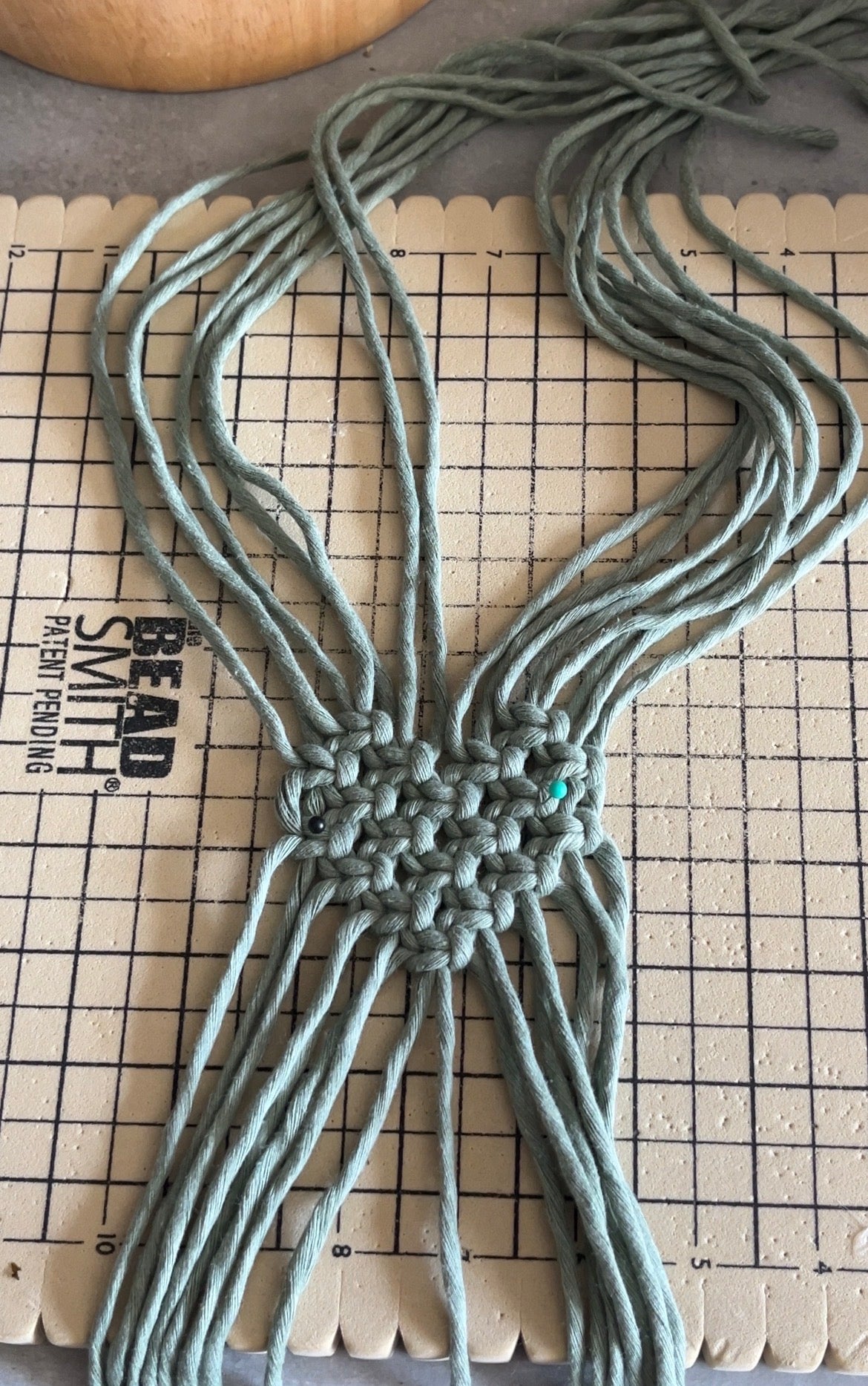Macrame project on a grid surface board