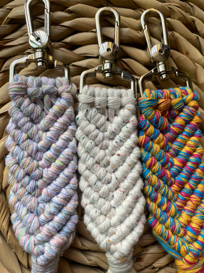 Three handmade macrame keyring, knotted using recycled cotton, in the shape of a mermaids tail, and finished with a metal lobster clasp. 