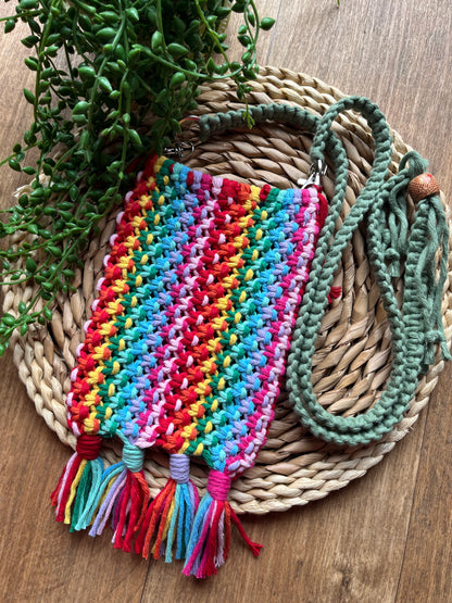 Colourful macrame bag with tassels on a wicker mat.