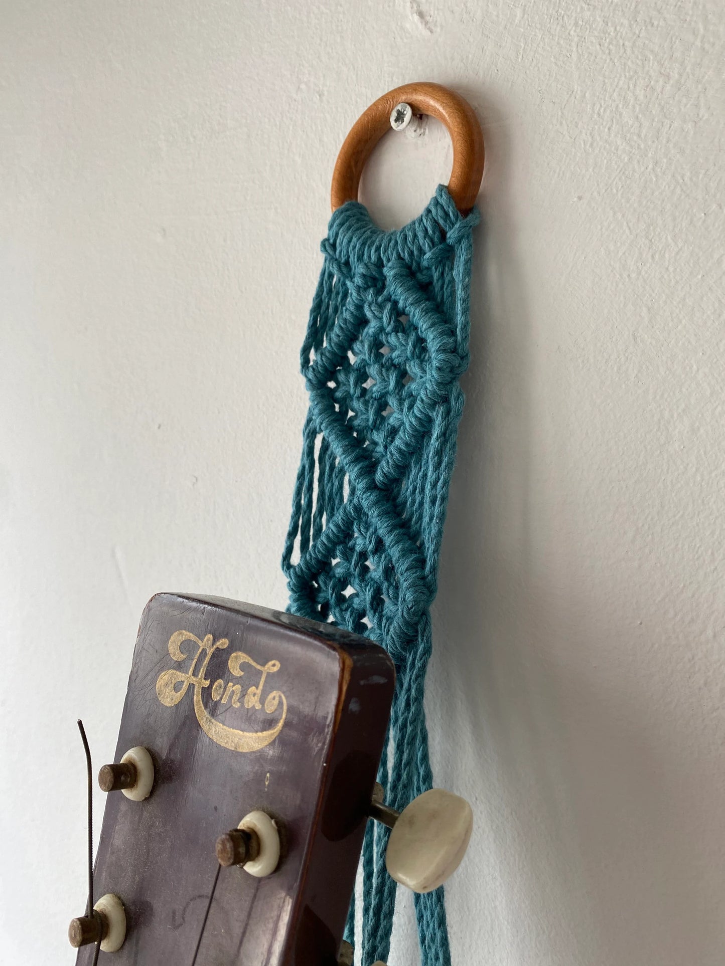 Macra-Made With Love acoustic guitar wall mount hanger teal top detail