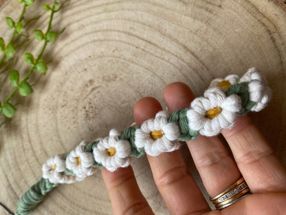 Macra-Made With Love daisy chain phone wrist strap white in hand