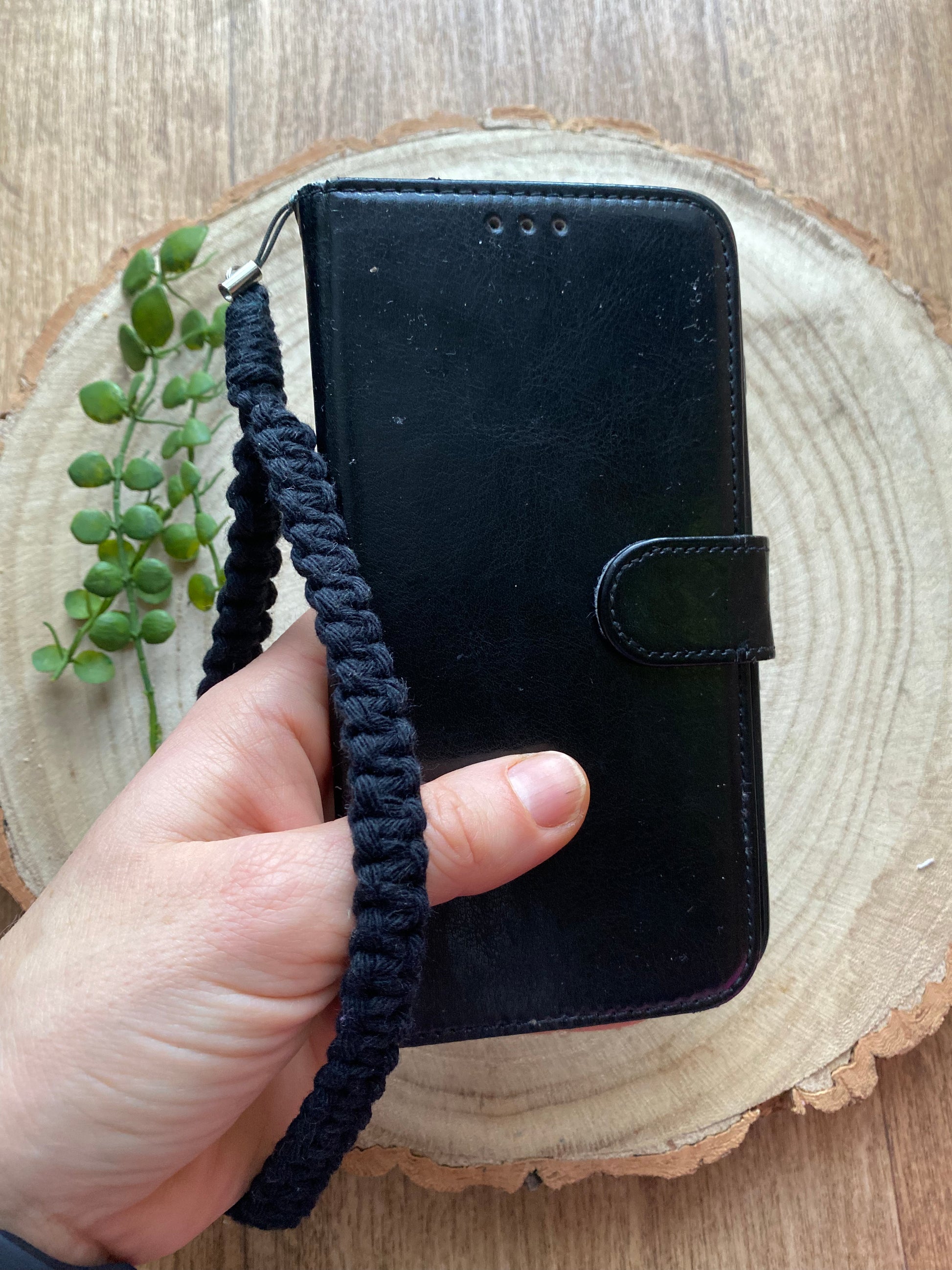 Macra-Made With Love phone charm black in hand