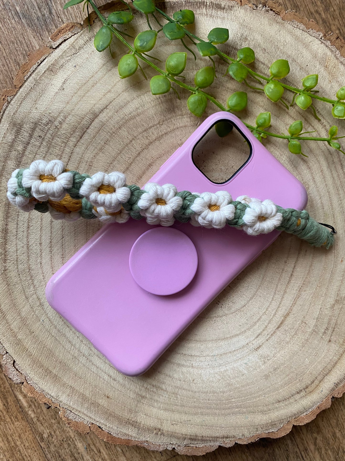 Macra-Made With Love daisy chain phone wrist strap white across phone case